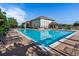 Resort-style pool featuring lounge chairs, a large pool house, clear blue water, and a beautiful blue sky at 494 Black Feather Loop # 108, Castle Rock, CO 80104