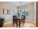 Elegant dining space featuring a chandelier and large windows for natural light at 15852 Lavender Pl, Broomfield, CO 80023