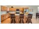 Contemporary kitchen featuring light wood cabinets, granite countertops, and stainless steel appliances at 15852 Lavender Pl, Broomfield, CO 80023