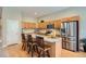 Stylish kitchen with granite counters, stainless steel appliances, and a center island with seating at 15852 Lavender Pl, Broomfield, CO 80023