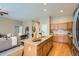 Open concept kitchen featuring an island, granite countertops and stainless steel appliances at 15852 Lavender Pl, Broomfield, CO 80023