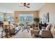 Spacious living room with large windows offering natural light, complemented by elegant furnishings at 15852 Lavender Pl, Broomfield, CO 80023