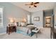 Comfortable main bedroom with soft colors, a sitting bench, and ensuite bathroom access at 15852 Lavender Pl, Broomfield, CO 80023
