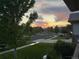 Picturesque street view showcasing the neighborhood, complete with sidewalks, trees, and a vibrant sunset at 15852 Lavender Pl, Broomfield, CO 80023