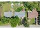 Wide aerial view of the property, highlighting the location, backyard, mature trees, and surrounding neighborhood at 2440 Saulsbury St, Lakewood, CO 80214