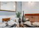 Elegant dining room with glass-top table, decorative vases, and chandelier lighting at 2440 Saulsbury St, Lakewood, CO 80214