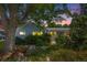 Charming single story home with mature landscaping and colorful flower beds at 2440 Saulsbury St, Lakewood, CO 80214