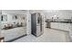 Updated kitchen with stainless steel appliances and an open design at 2440 Saulsbury St, Lakewood, CO 80214