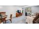 Cozy living room with plush seating, entertainment center, and large window at 2440 Saulsbury St, Lakewood, CO 80214