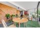 Cozy covered patio with wooden furniture, plants and decor at 2440 Saulsbury St, Lakewood, CO 80214