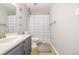 Full bathroom showcasing stylish fixtures, neutral tones, and a shower with curtain at 8465 Pebble Creek Way # 102, Highlands Ranch, CO 80126