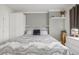 Bright bedroom featuring sleek built-ins, light gray walls, and a comfortable bed at 8465 Pebble Creek Way # 102, Highlands Ranch, CO 80126