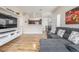 Spacious living room with view into kitchen and dining area provides flexible living at 8465 Pebble Creek Way # 102, Highlands Ranch, CO 80126