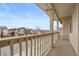 Balcony with wooden railing overlooking street and neighborhood homes at 13000 W Grant Cir # C, Thornton, CO 80241