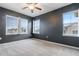 Dark blue bedroom with three windows that provide lots of natural light at 13000 W Grant Cir # C, Thornton, CO 80241
