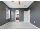 Dark blue bedroom with carpet, ceiling fan, bathroom and closet access at 13000 W Grant Cir # C, Thornton, CO 80241