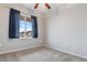 Cozy bedroom with neutral carpet and a window offering natural light at 13000 W Grant Cir # C, Thornton, CO 80241