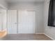 Cozy bedroom featuring a double door closet and neutral gray walls at 13000 W Grant Cir # C, Thornton, CO 80241