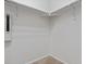 Walk-in closet with shelving and wall-mounted Usteck air purification system at 13000 W Grant Cir # C, Thornton, CO 80241