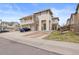 Charming two-story townhome featuring a balcony, attached garage, and inviting front entrance at 13000 W Grant Cir # C, Thornton, CO 80241