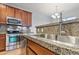 Granite countertops and stainless steel appliances enhance this contemporary kitchen design at 13000 W Grant Cir # C, Thornton, CO 80241
