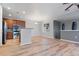 Open living space featuring hardwood floors and a kitchen with stainless steel appliances at 13000 W Grant Cir # C, Thornton, CO 80241