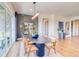 Dining area with natural light, elegant furniture, and easy access to the outdoor living space at 22077 E Rockinghorse Pkwy, Aurora, CO 80016