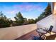 A cozy balcony that presents a breathtaking, natural landscape dominated by trees and a stunning skyline at 929 Coneflower Dr, Golden, CO 80401