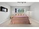 Cozy bedroom with a plush carpet, a modern lamp, and neutral tones at 929 Coneflower Dr, Golden, CO 80401