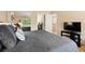 Comfortable bedroom featuring a plush bed, mirrored closet, and neutral decor at 929 Coneflower Dr, Golden, CO 80401