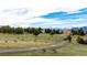 Beautiful community scenery with a herd of elk grazing on open fields and snow-capped mountains in the distance at 929 Coneflower Dr, Golden, CO 80401