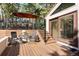 Inviting outdoor living space features a wooden deck with seating areas and steps leading to the yard and main level at 929 Coneflower Dr, Golden, CO 80401