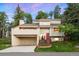 Stunning two-story home boasting a red front door, a two-car garage, and beautiful landscaping at 929 Coneflower Dr, Golden, CO 80401