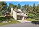 Attractive home featuring an attached garage, wood decks, and mature landscaping at 929 Coneflower Dr, Golden, CO 80401