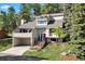 Beautiful home with a red front door, attached garage, and professional landscaping at 929 Coneflower Dr, Golden, CO 80401