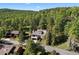 Charming two-story home with a red door nestled amongst lush trees and natural beauty of the surrounding landscape at 929 Coneflower Dr, Golden, CO 80401