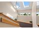 Hallway featuring a staircase, multiple skylights, natural light and outdoor views at 929 Coneflower Dr, Golden, CO 80401
