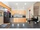 Bright kitchen features wood cabinets, granite countertops, stainless steel appliances, and recessed lighting at 929 Coneflower Dr, Golden, CO 80401