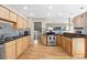Kitchen area features hardwood floors, granite countertops, stainless steel appliances and tiled backsplash at 929 Coneflower Dr, Golden, CO 80401