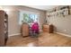 Bright office area features hardwood floors, a large window, and ample natural light at 929 Coneflower Dr, Golden, CO 80401