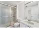 Bathroom features a shower with glass doors, a vanity with sink and tile floors at 7865 E Mississippi Ave # 1502, Denver, CO 80247