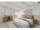 Cozy bedroom featuring neutral tones, soft lighting, and comfortable bedding at 7865 E Mississippi Ave # 1502, Denver, CO 80247
