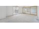 Bright bedroom with neutral carpet, large window and mirrored closet at 7865 E Mississippi Ave # 1502, Denver, CO 80247