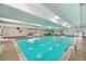 Bright indoor pool with ample seating and well-maintained deck area at 7865 E Mississippi Ave # 1502, Denver, CO 80247