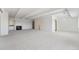Spacious living room featuring new carpet, neutral walls, a fireplace, and access to kitchen and bar at 7865 E Mississippi Ave # 1502, Denver, CO 80247