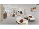 Bright and airy living room with carpet, beamed ceilings, modern decor, and large windows at 7865 E Mississippi Ave # 1502, Denver, CO 80247