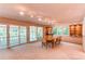 Dining room features a large table, natural light, and built-in display cabinets at 8888 W 37Th Pl, Wheat Ridge, CO 80033