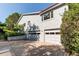 Exterior view of a two-story home with a two-car garage and concrete driveway at 8888 W 37Th Pl, Wheat Ridge, CO 80033