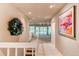 Hallway with tile flooring and artwork, leading into an open living space with recessed lighting at 8888 W 37Th Pl, Wheat Ridge, CO 80033