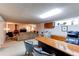 Open basement office space with built-in desk, seating and lots of natural light at 8888 W 37Th Pl, Wheat Ridge, CO 80033